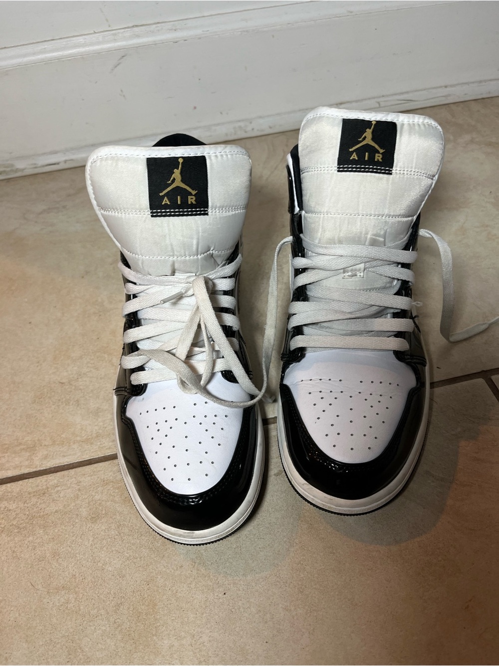 Jordan High-Top Sneakers in White, Black, and Gold